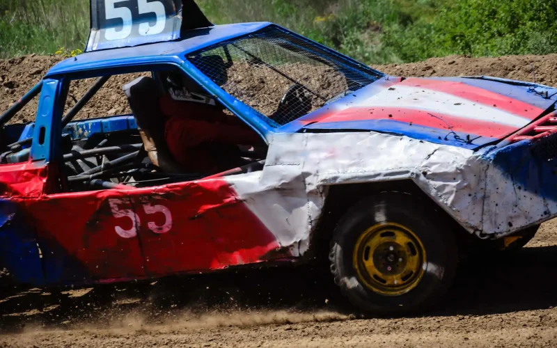 demolition-derby-car-racing-along-a-dirt-track-2026-01-11-08-36-34-utc