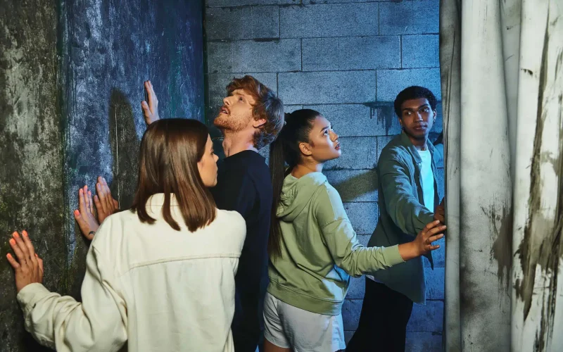 group-of-people-looking-upward-in-an-escape-room-2026-03-11-04-14-13-utc