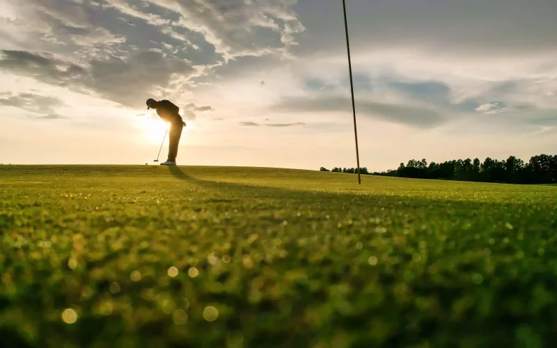 silhouette-of-a-golfer-putting-on-a-green-at-sunse-2026-07-14-04-04-23-utc